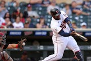 Minnesota Twins' Miguel Sano (22) strikes out against the Cleveland Indians during the seventh inning of the first baseball game of a doubleheader Tue