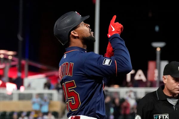 The Twins’ Byron Buxton pointed skyward after belting a three-run home run off Blue Jays starter Jose Berrios in the third inning Friday night.