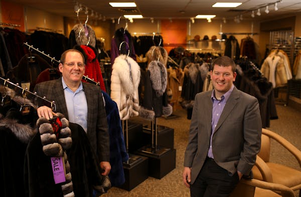 Bill Ribnick, left, with his son, Justin, in this 2016 photo. Ribnick Luxury Outerwear the North Loop’s oldest retailer will close for good in Decem