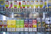 This file photo from April 2021 shows flavored e-cigarette nicotine products on the shelf at a shop in Bloomington. JEFF WHEELER • jeff.wheeler@star