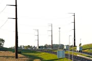 Big transmission lines run along Highway 52, across the farmland and seen Wednesday outside Hampton. ] DAVID JOLES • david.joles@startribune.com Wed