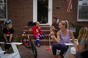 Carrie Tollefson had her nails painted by her daughter, Ruby, 11, while her youngest, Greer, 5, got ready to climb on the patio furniture and Everett,