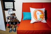 A pillow bearing the logo of DuckDuckGo