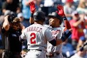 Minnesota Twins' Jorge Polanco (11) is congratulated at home plate by Luis Arraez (2) after hitting a three-run home run during the first inning of a 