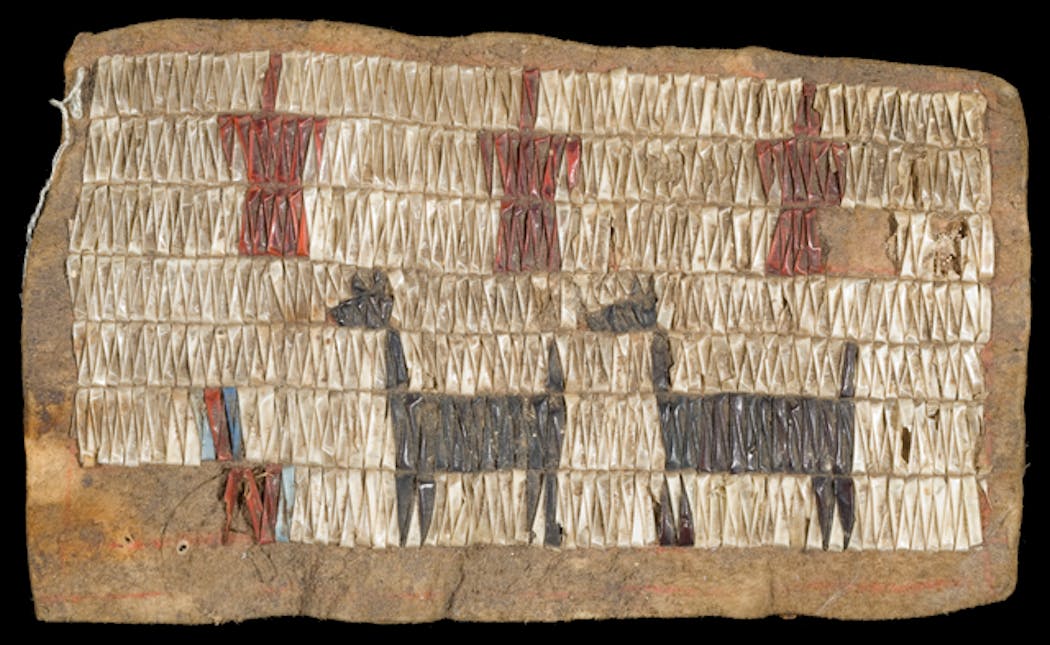 A hide decorated with dyed quills to illustrate dogs and birds. A Dakota person created it as part of a cradleboard, used to carry babies, likely between the 1770s and 1850s.