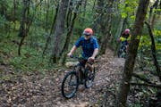 Chad McDonald rides the mountain bike trails of Willow River State Park in Hudson.