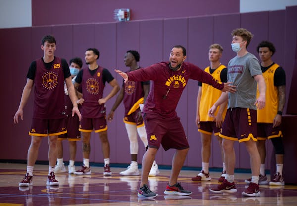 Gophers men’s basketball head coach Ben Johnson explained a drill to players at practice this fall.