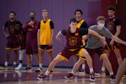 Will Ramberg (25) went to work during a preseason Gophers practice.