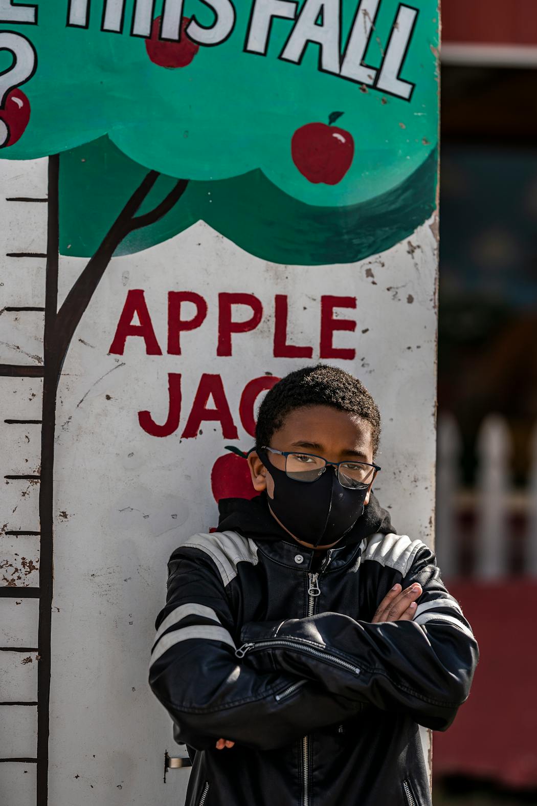 Zealous Sirakavit, 12, poses for a picture at a tape measure at Apple Jack Orchards in Delano. He says his homeschool group has been a huge source of community during a difficult year and a half.