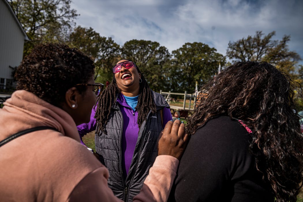 Rey Sirakavit, center, enjoys bonding with parents Angel Woods, left, and Tryenyse Jones, right. Sirakavit and Jones were two of the founding members of a Black homeschool support group.
