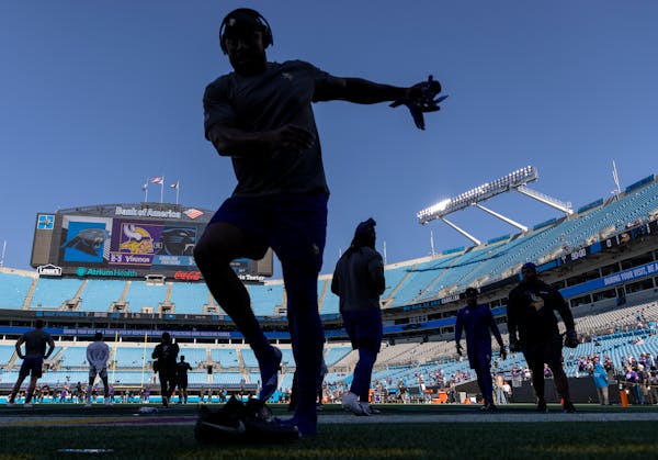 Vikings players warm up in Charlotte. 