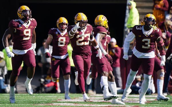 The Gophers defense celebrated after stopping a Nebraska fourth down attempt in the third quarter.