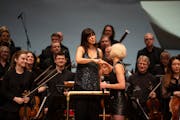 Dessa and Minnesota Orchestra conductor Sarah Hicks bumped fists at the end of the concert. 