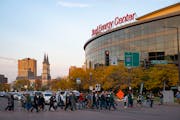Minnesota Wild fans crossed Seventh St. ahead of the home opener at Xcel Energy Center in St. Paul on Tuesday.