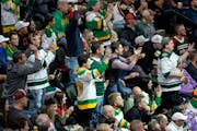 Fans cheered during the first period of Tuesday’s Wild home opener at the Xcel Energy Center.