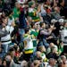 Fans cheered during the first period of Tuesday’s Wild home opener at the Xcel Energy Center.