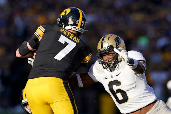 Purdue linebacker Jalen Graham (6) tackled Iowa quarterback Spencer Petras (7) during the second half of the Hawkeyes’ 24-7 loss last Saturday.