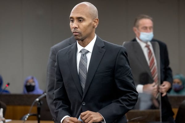 Former police officer Mohamed Noor makes his way to the podium to address Judge Kathryn Quaintance today at the Hennepin County Government Center.