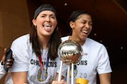 Stefanie Dolson, left, and Candace Parker of the Sky celebrated their WNBA championship during a rally at Millennium Park in Chicago on Tuesday.