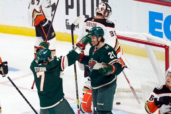 Wild rookie Brandon Duhaime (21) was congratulated by Nico Sturm after Duhaime scored in the first period Saturday night.