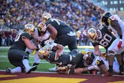 Gophers running back Bryce Williams scores a rushing touchdown during the third quarter 
