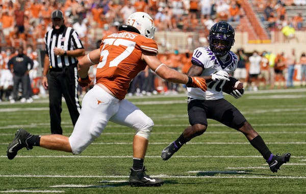 JD Spielman (10) ran around Texas linebacker Cort Jaquess (57) during the first half of a TCU game on Oct. 3, 2020.