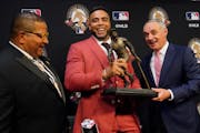 Rob Manfred, Nelson Cruz and Luis Roberto Clemente, son of the late Hall of Famer Roberto Clemente 