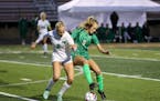 Edina’s Maddie Dahlien (5) maneuvers the ball around Mounds View’s Claire Redlinger (2) in the second half. Dahlien scored in the 50th minute to g