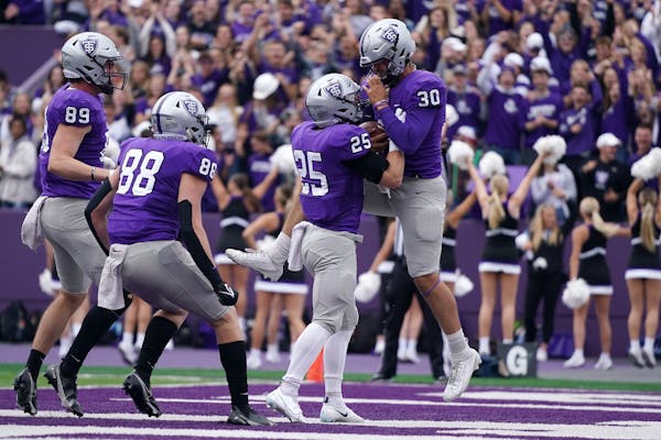 The Tommies celebrated during a 36-0 win over Butler in their first ever Pioneer League game in September.