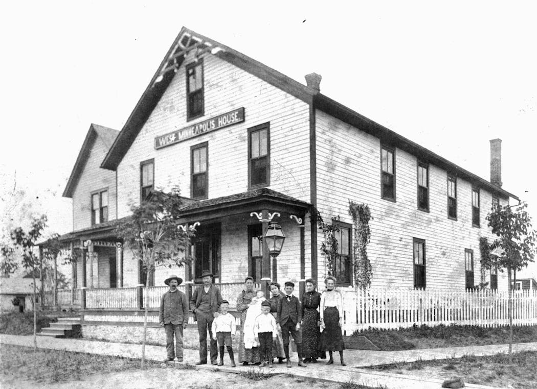 People standing in front of the West Minneapolis House, a hotel in what is now Hopkins, in the early 1900s.