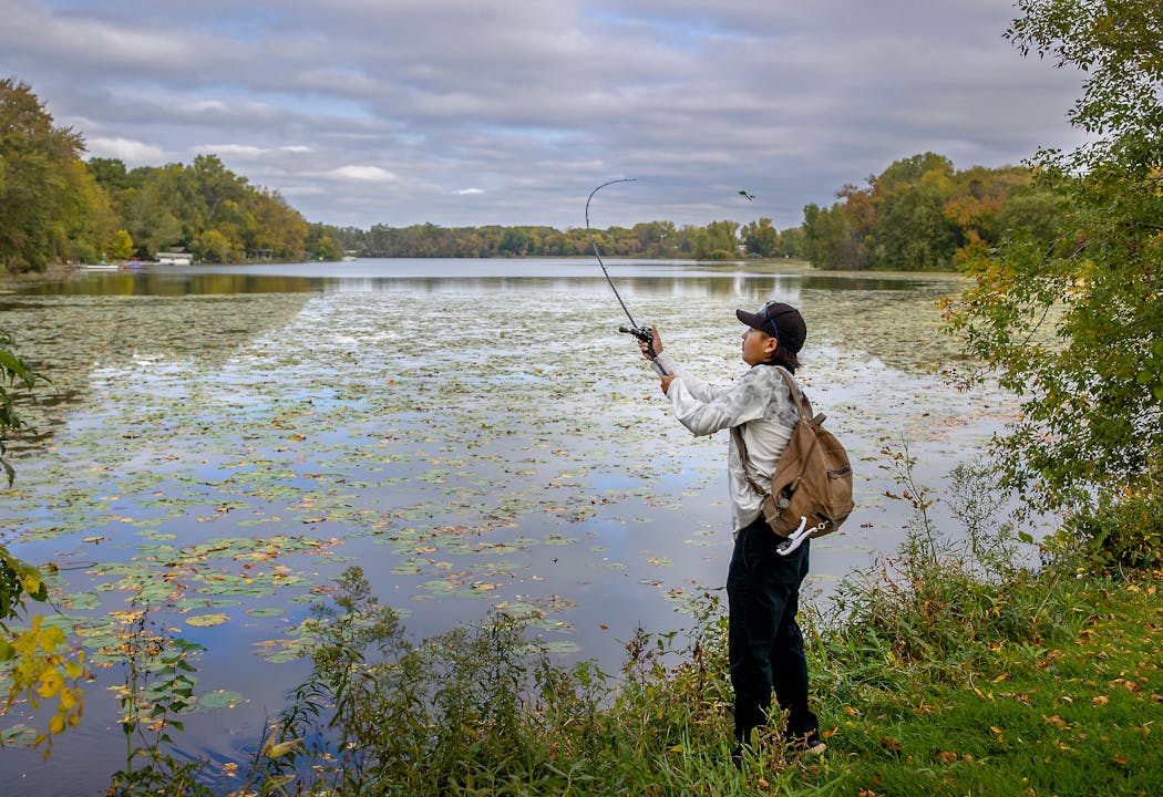 A man fished for bass at Maplewood's Keller Regional Park in October 2021.