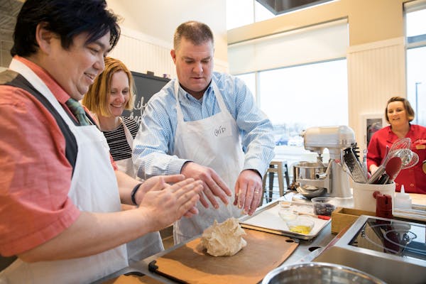Chip Scoggins, center, once took a cooking class with Crystal Boudreau, the wife of former Wild coach Bruce Boudreau.