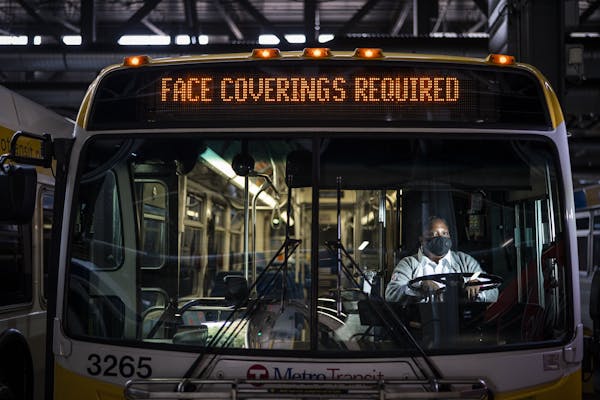 Metro Transit bus driver Lauren Cox posed for a portrait at the East Metro Garage in St. Paul.