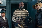 Idris Elba (in stripes) is the meanest varmint in “The Harder They Fall.”