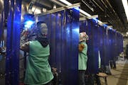 Pine Technical and Community College welding program student Joshua Hasching, left, welded in the college’s mobile welding lab, where students have 