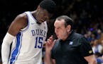 Duke center Mark Williams received direction from head coach Mike Krzyzewski during a game last season.