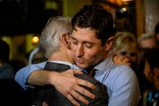 Incumbent Minneapolis Mayor Jacob Frey hugged his father at his campaign’s election night party at Jefe Urban Cocina Tuesday, Nov. 2, 2021 in Minnea