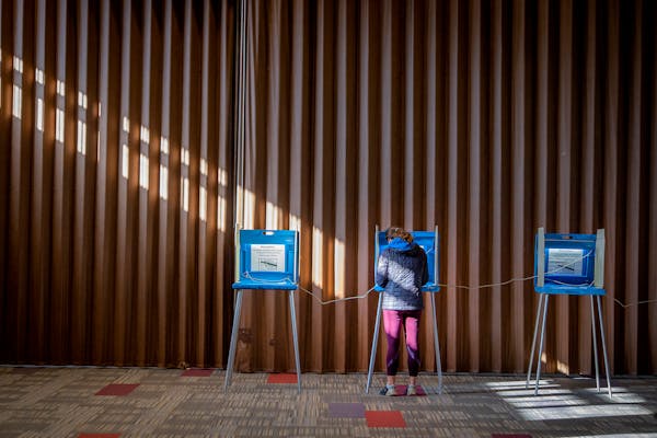 Voters cast their ballot at Temple of Aaron on Tuesday, Nov. 2, 2021, in St. Paul, which became the first Midwestern city to enact rent control. 