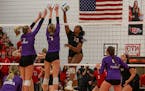 Eden Prairie middle blocker Kendall Minta (13) guides a shot past Chaska defenders Mallory Heyer (7) and Avery Rosenberg (4). Class 4A Section 2 volle