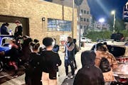 Protesters gather outside a downtown condominium complex to demand that Hennepin District Judge Regina Chu allow the broadcasting of ex-officer Kim Po