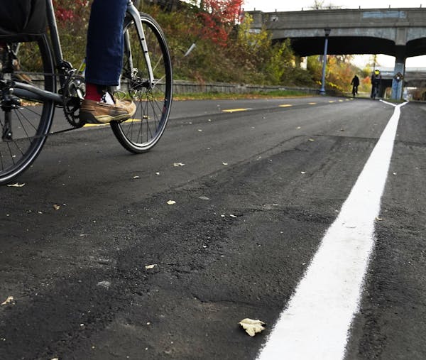 Bicyclists rode along the Midtown Greenway on Tuesday in Minneapolis.