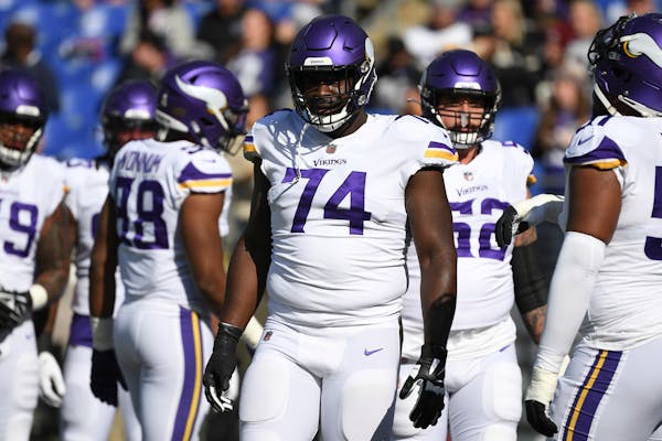 Minnesota Vikings guard Olisaemeka Udoh (74) looks on during pre-game warm-ups before an NFL football game against the Baltimore Ravens, Sunday, Nov. 