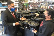 BMO banker Saul Hernandez chatted with Olivia Rodriguez, co-owner of El Rey Car Audio, which with a BMO loan plans to rebuild in a larger building it 