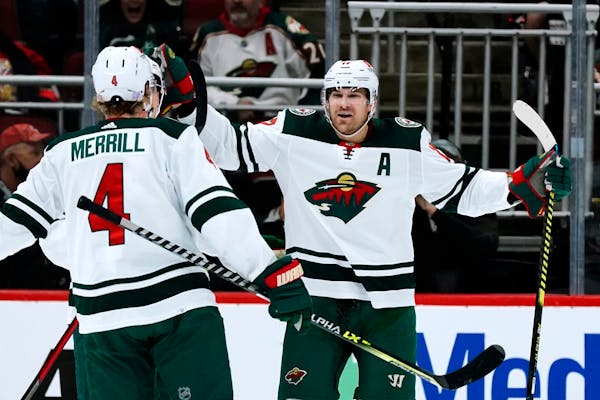 Wild left winger Marcus Foligno (right) celebrated his first-period goal against the Coyotes with defenseman Jon Merrill on Wednesday.