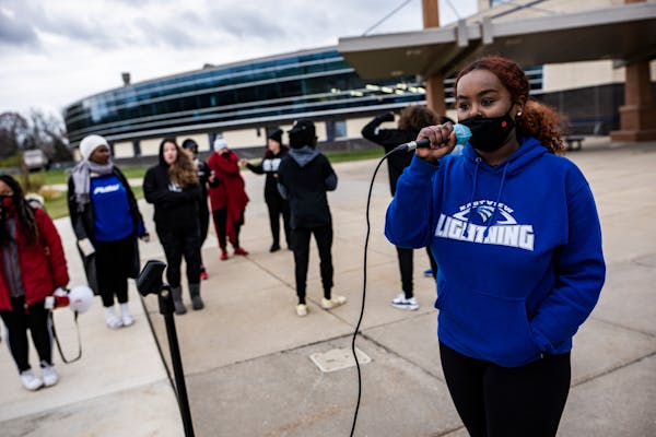 Protesters gathered Thursday at Prior Lake High School to voice their opposition to a racist video that emerged from a student. Sarah Abraham, 16, tra