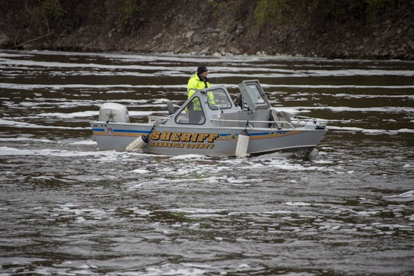 A deputy from the Hennepin County Sheriff’s office searched for a missing person in the Mississippi River in 2017.