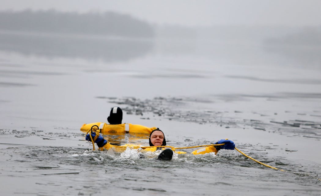 Hennepin County Sheriff's Deputy Alan Lange performs a mock ice rescue on Lake Minnetonka in 2015.