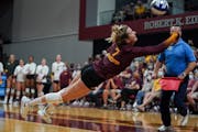 C.C. McGraw, shown facing Texas earlier this season, leads the Gophers with 396 digs on the season.