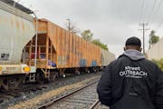 Randy Flowers, a street outreach worker for St. Stephen’s Human Services, checks in on someone sheltering in a rail yard. Give to the Max Day is Nov