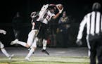Eden Prairie wide receiver Michael Gross (82) catches a pass for a touchdown as Farmington defensive back Dylan Olson (10) tried to stop him in the fi